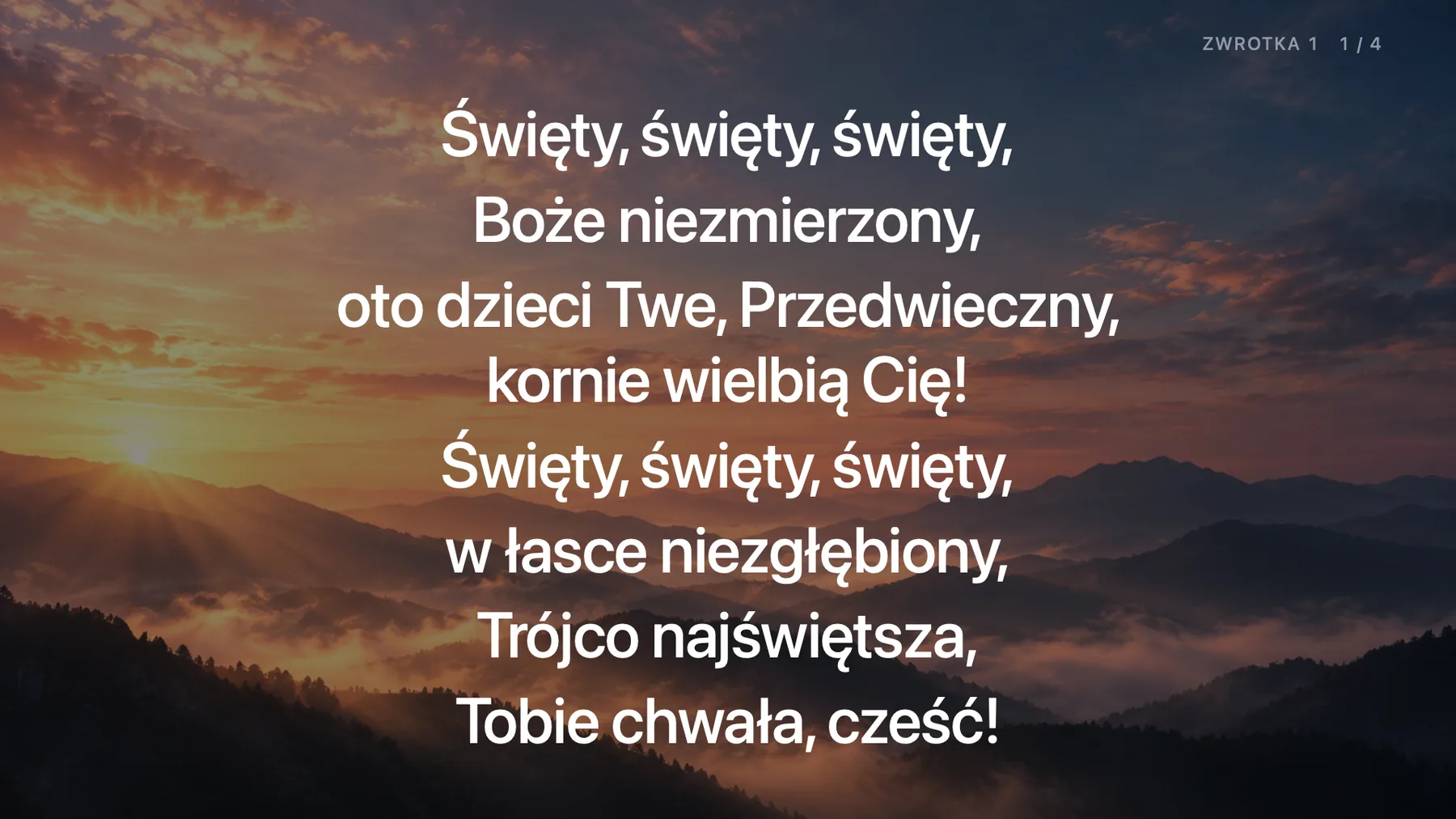 Tekst pieśni na rzutniku, na tle ze zdjęciem